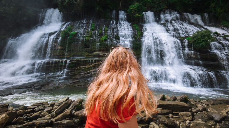 Woman appreciating Rock Island waterfall