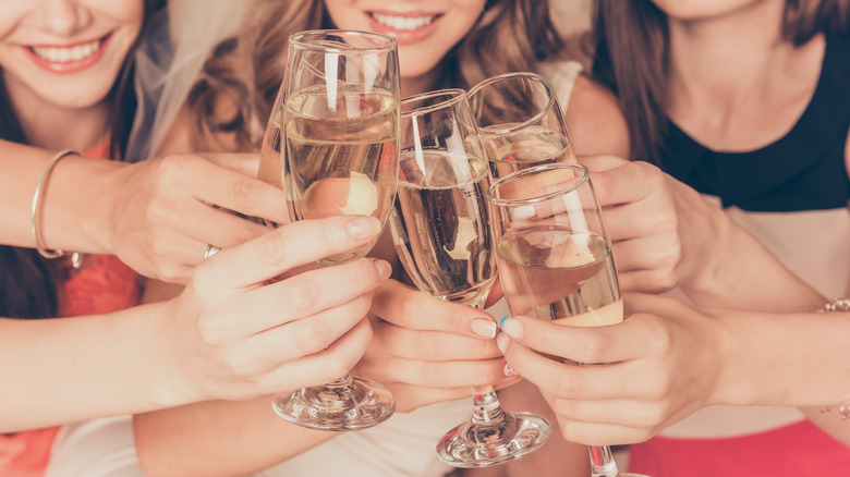women toasting with champagne glasses