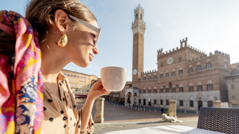woman drinking coffee in venice