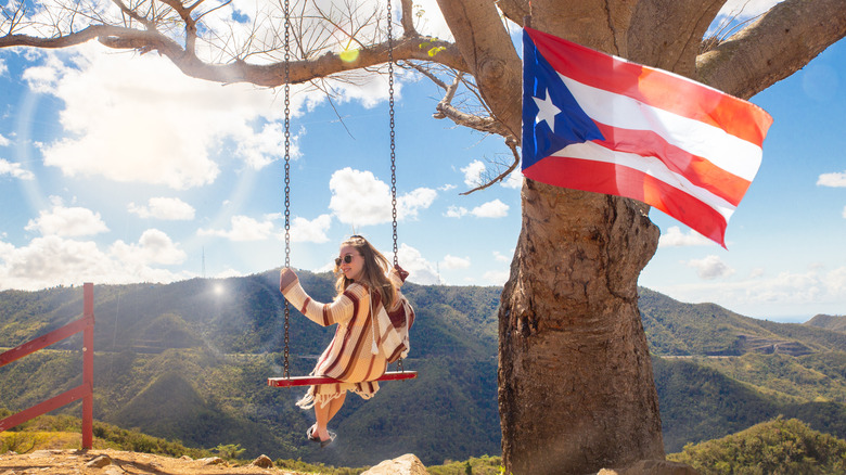 woman swinging with puerto rican flag
