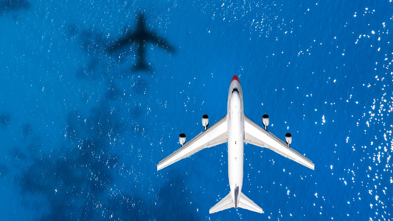 an airplane over the ocean